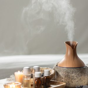 Spa composition with air humidifier and aroma oils. Spa composition with air humidifier and aroma oils. Essential oil aroma diffuser humidifier diffusing water articles in the air.